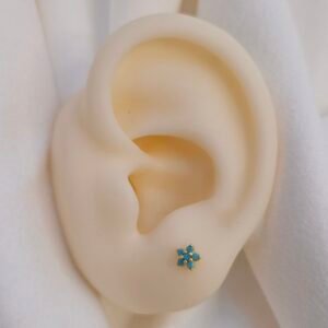 aretes dorados flor turquesa