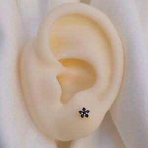 Aretes dorados flor azul