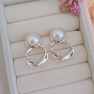 Aretes largos de perla